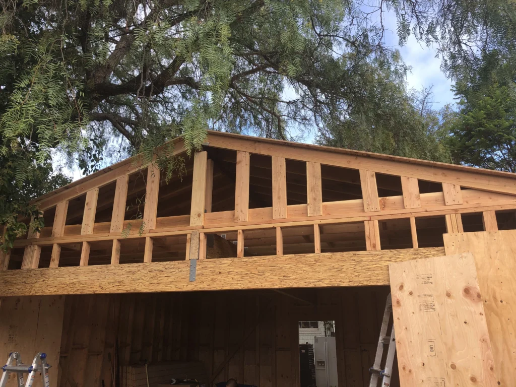 A garage being built with wood framing.