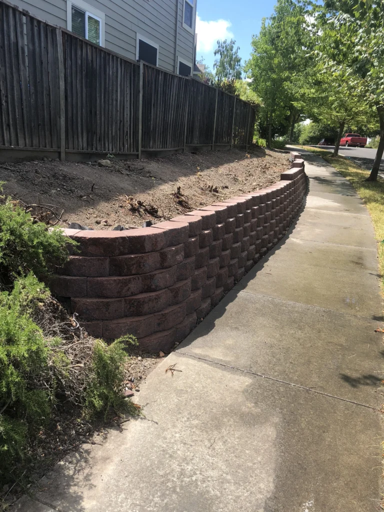 A retaining wall in a residential neighborhood.